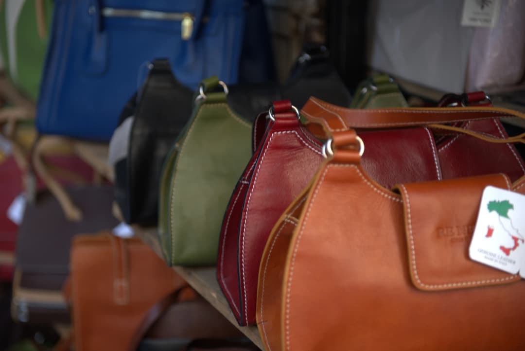 leather handbags at a market in Florence