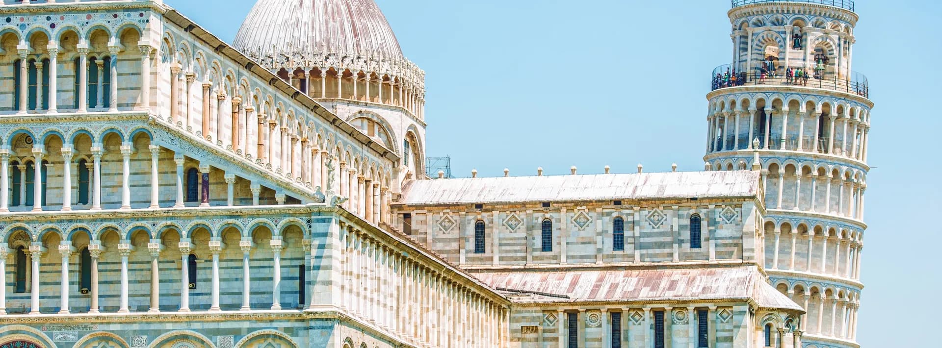 the leaning tower of Pisa with the cathedral in the foreground in Pisa, Italy