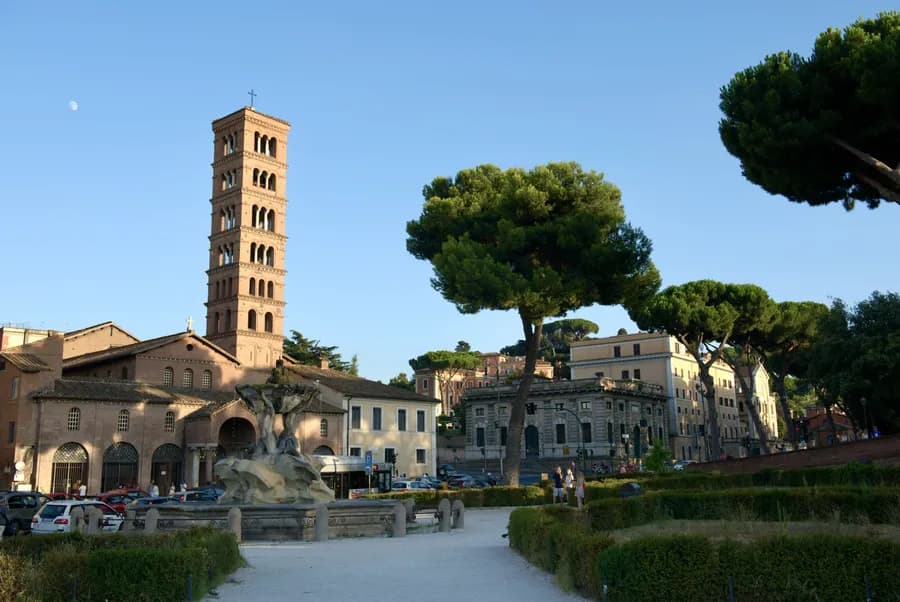 The Santa Maria Cosmedin and Fontana dei Tritoni in Rome just before sunset