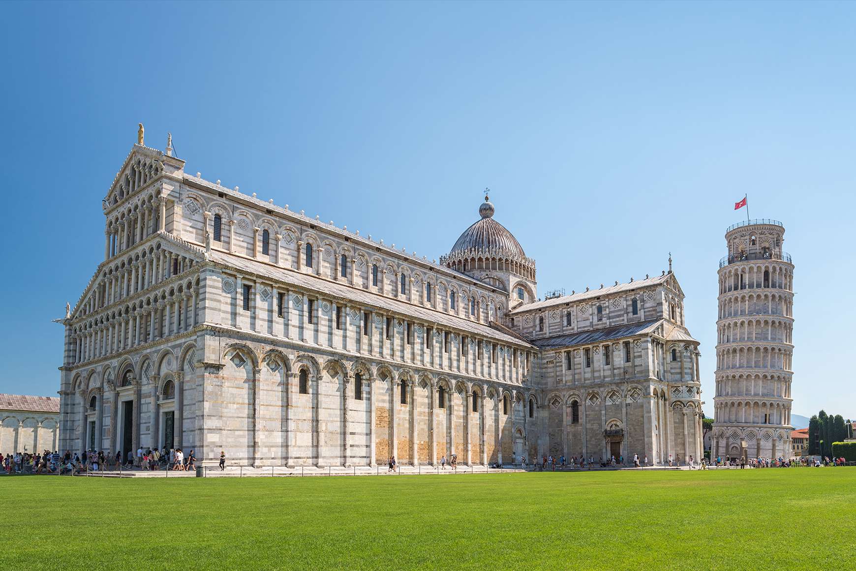 Exterior view of the Pisa Cathedral with the Leaning Tower to its right
