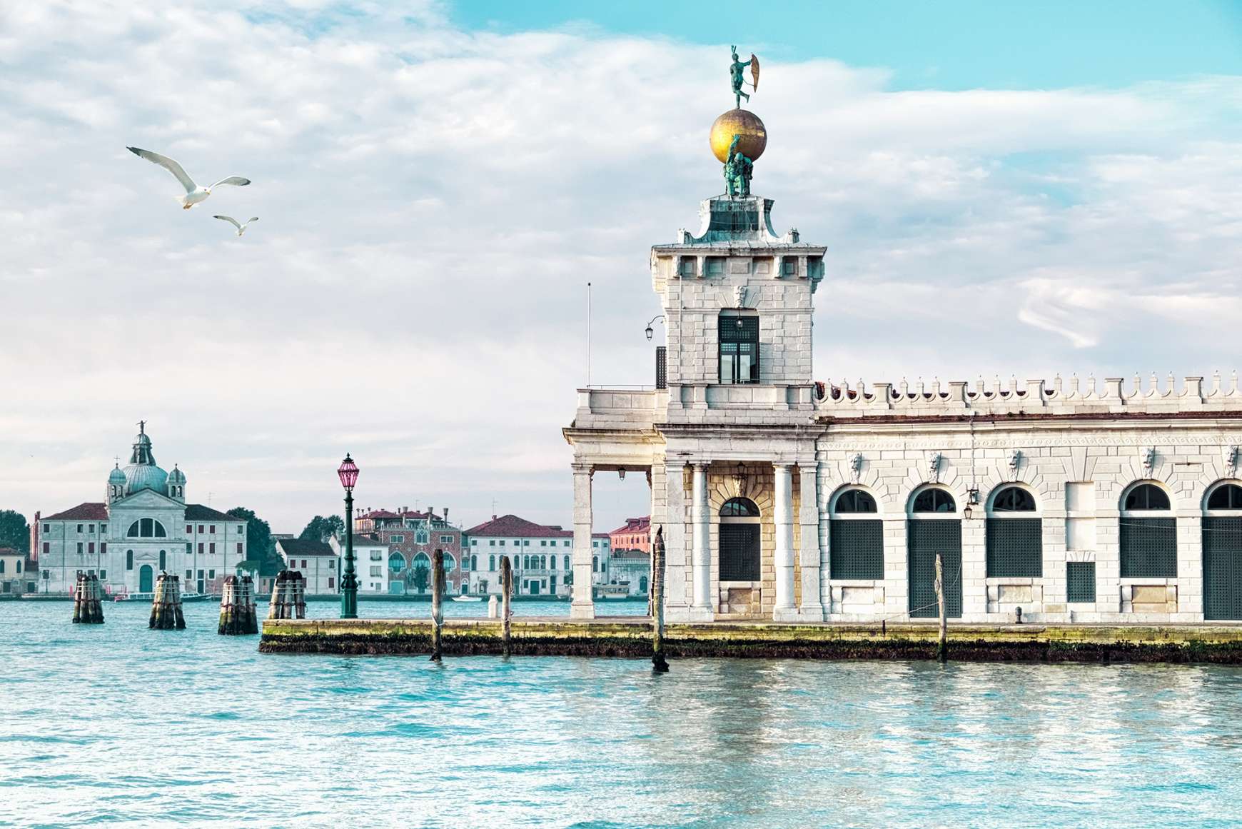 View of Punta della Dogana's art center jutting out into the water in Venice