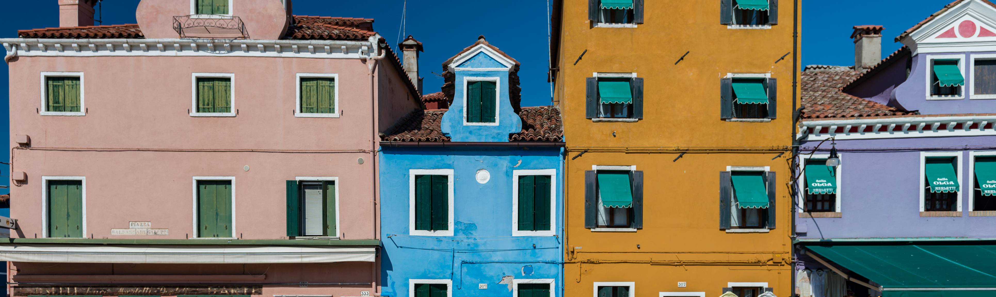 Colorful row of buildings in Burano, Italy