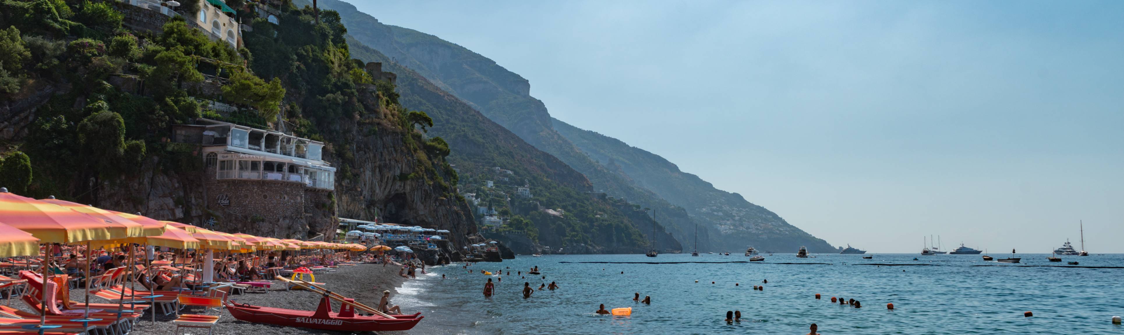 Panoramic view of people bathing in beaches of Amalfi Coast