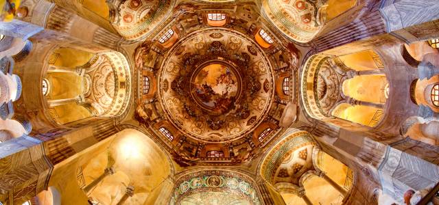 Looking up at mosaics of the octagonal interior of Basilica San Vitale