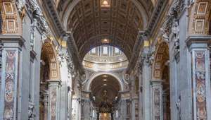 View of walls and vaulted archways of St. Peter's Basilica in Rome