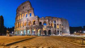 Rome's Colosseum illuminated against the evening sky, Italy tours